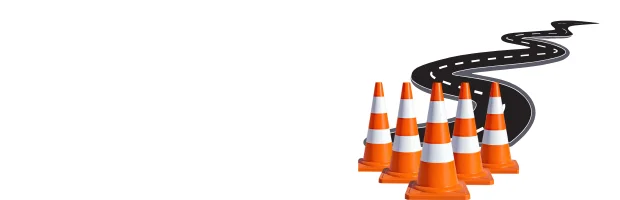 交通安全コーンとカーブした道路